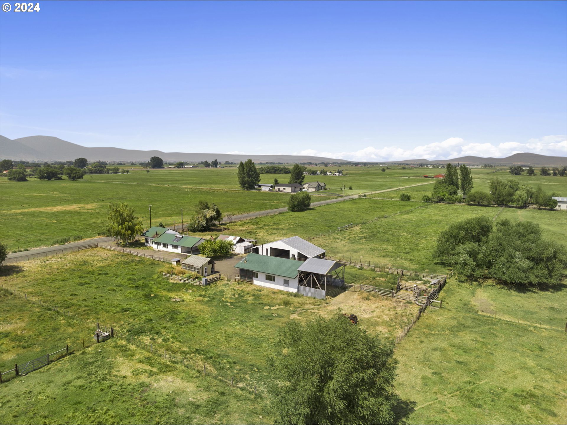 42811 Hudson Road Baker City, OR 97814 - Photo 3 of 46 a view of a city with lush green forest
