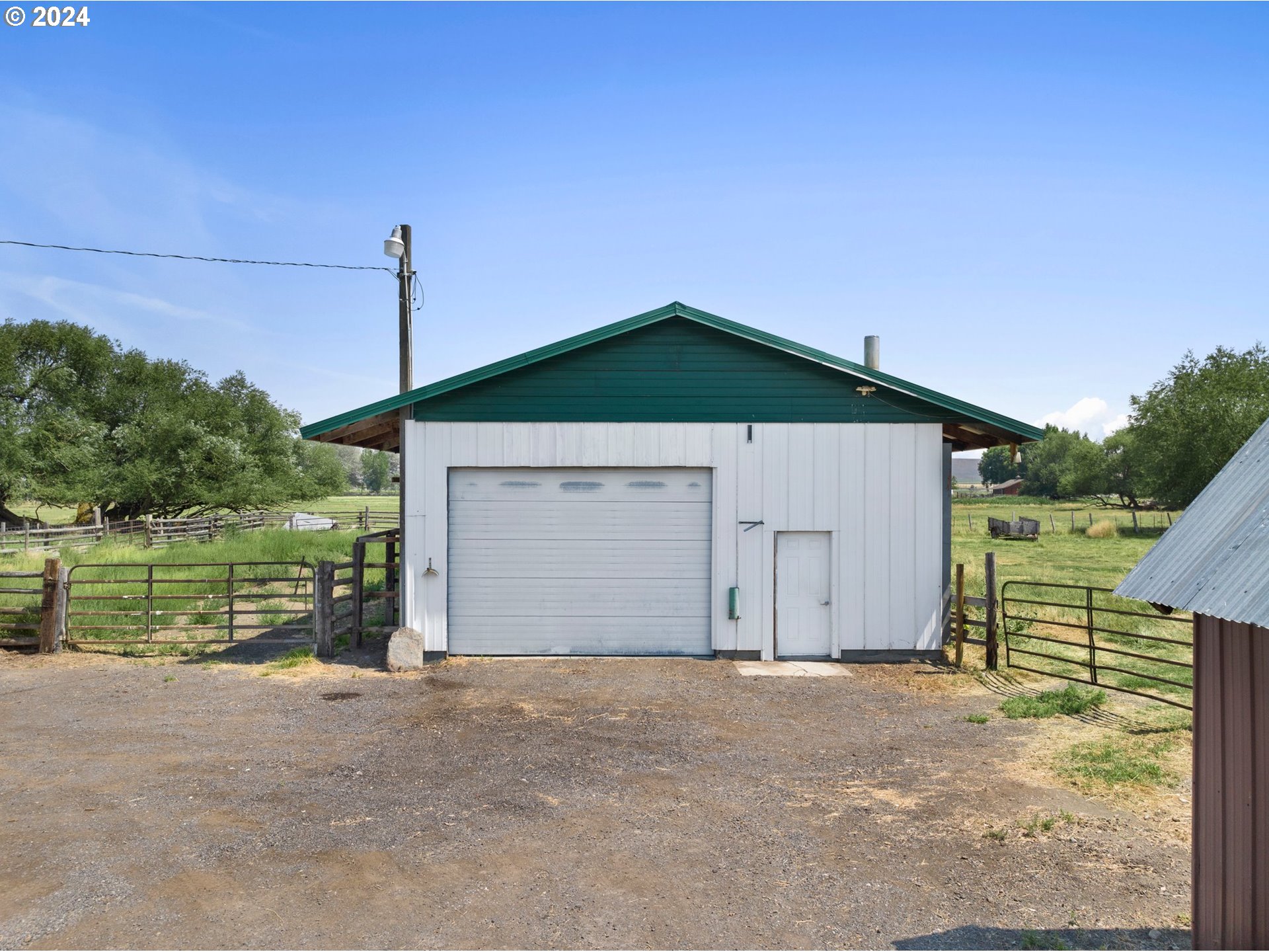 42811 Hudson Road Baker City, OR 97814 - Photo 32 of 46 a view of a house with a yard and garage