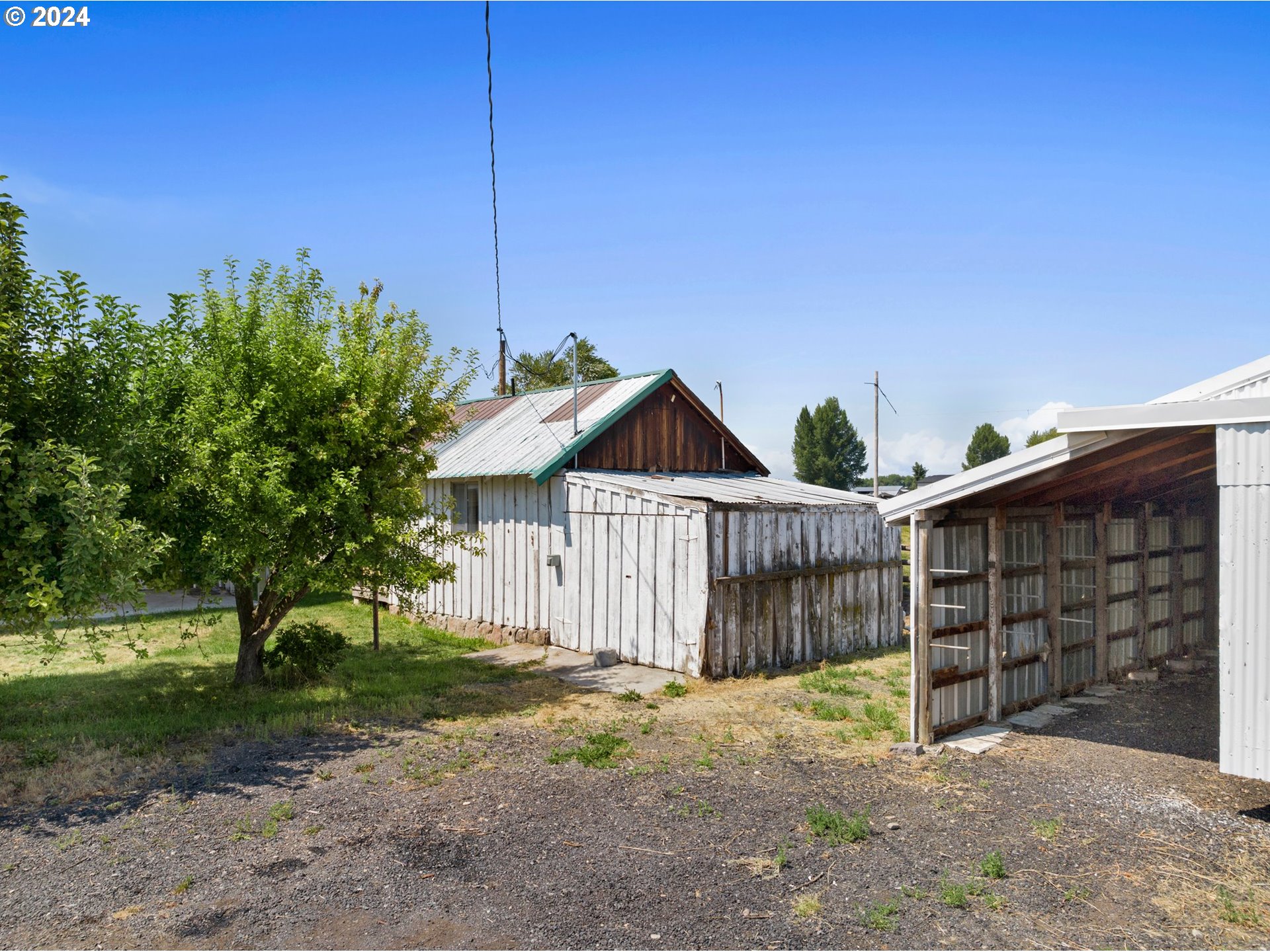 42811 Hudson Road Baker City, OR 97814 - Photo 39 of 46 a view of a house with a small yard and wooden fence