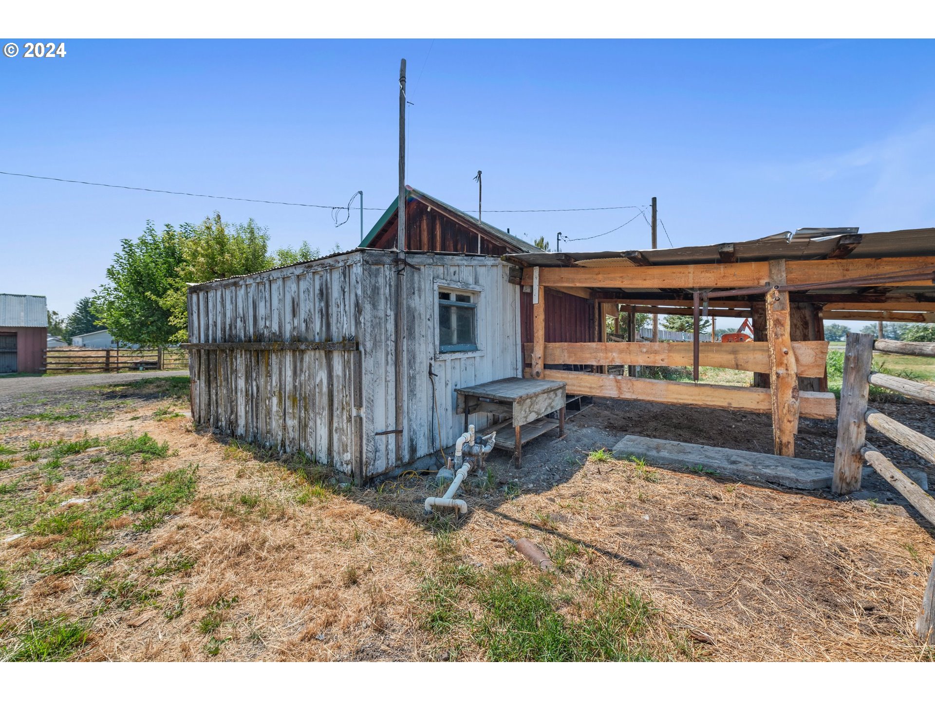 42811 Hudson Road Baker City, OR 97814 - Photo 40 of 46 a view of a backyard with a small cabin