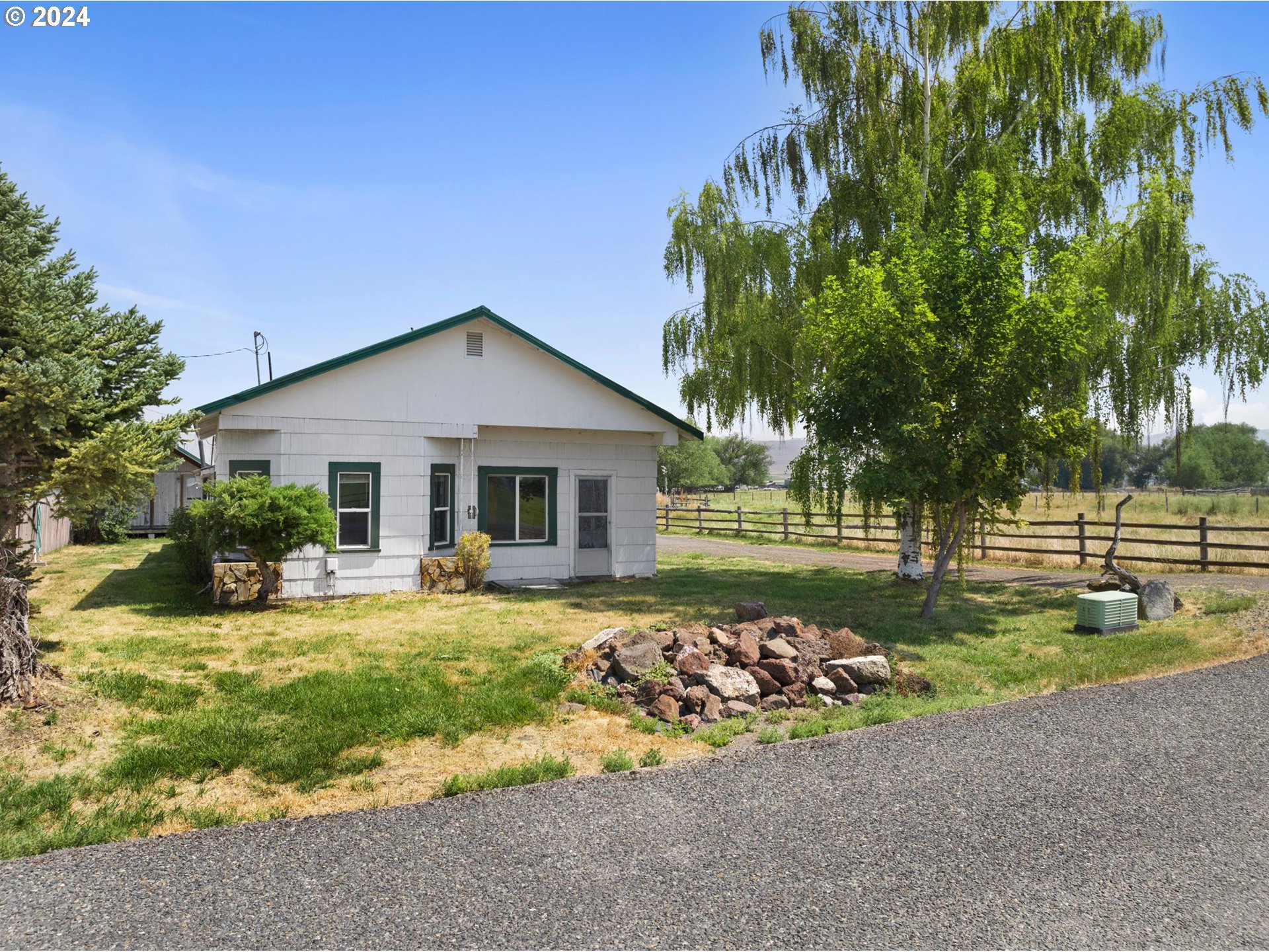 42811 Hudson Road Baker City, OR 97814 - Photo 6 of 46 a front view of a house with garden