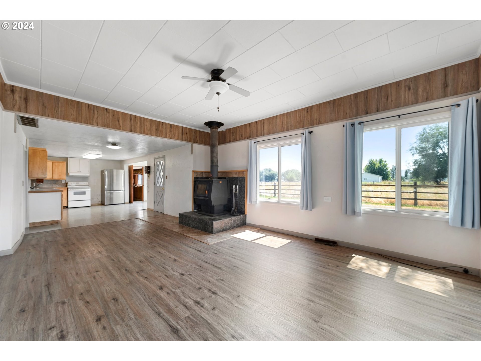 42811 Hudson Road Baker City, OR 97814 - Photo 7 of 46 a view of an empty room with window and wooden floor
