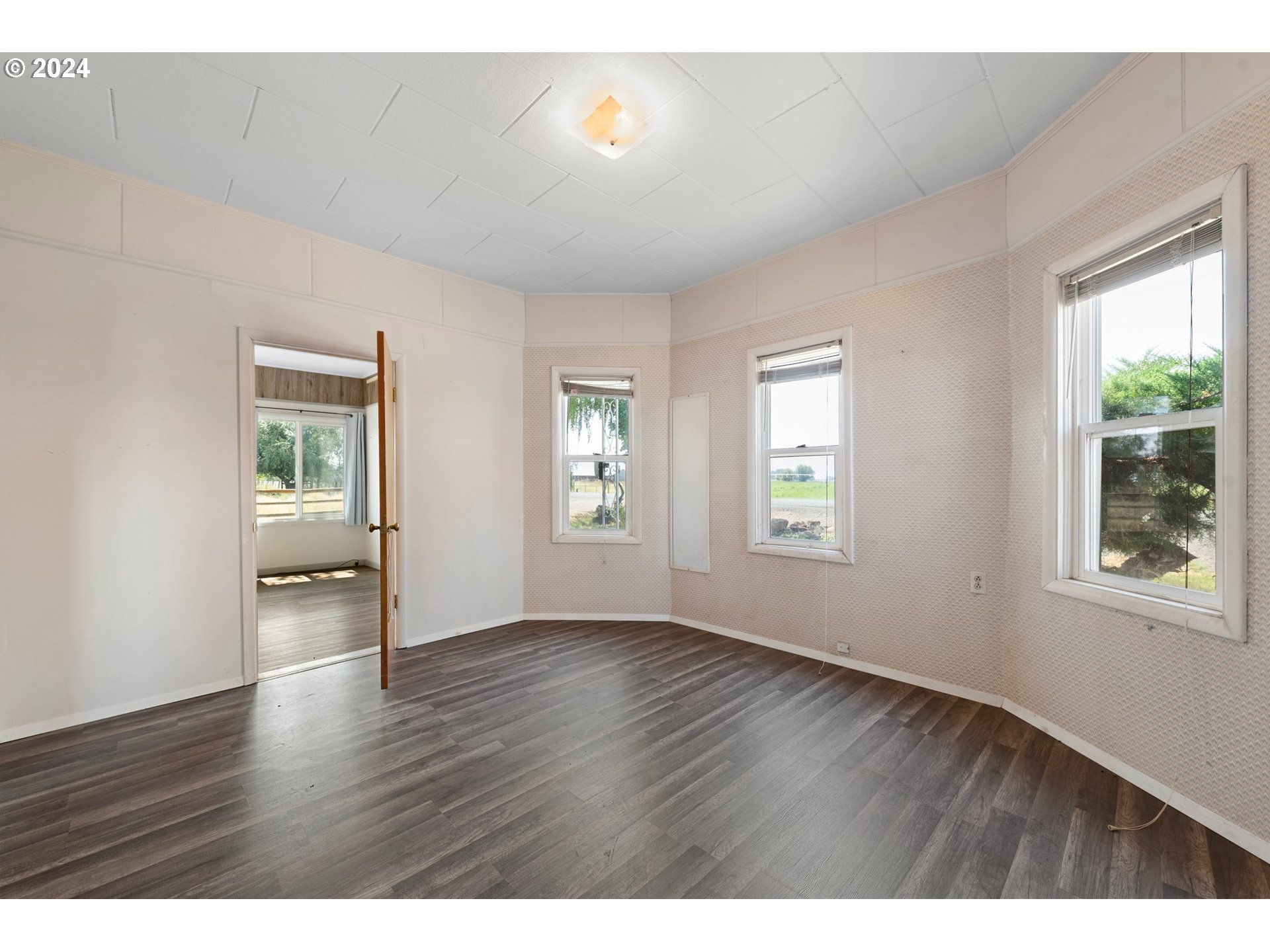 42811 Hudson Road Baker City, OR 97814 - Photo 9 of 46 an empty room with wooden floor and windows