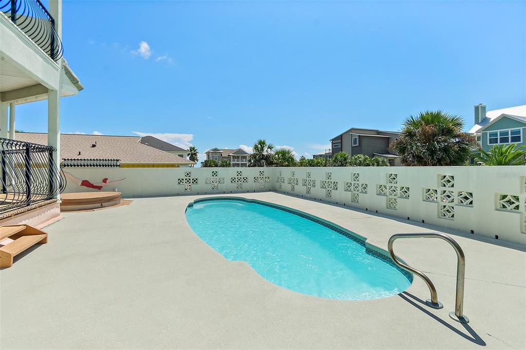 54 Ocean Street Palm Coast, FL 32137 - Photo 14 of 90 a view of a swimming pool with an outdoor seating and yard