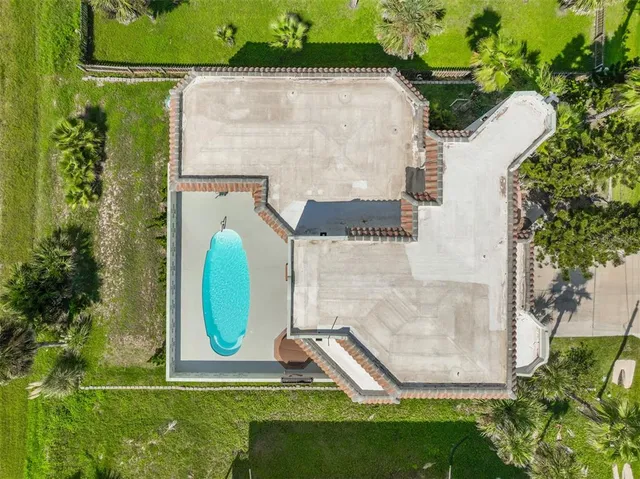 an empty room with a fireplace and painted walls