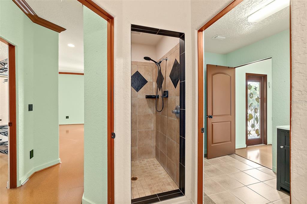 54 Ocean Street Palm Coast, FL 32137 - Photo 27 of 90 a view of a bathroom from a hallway