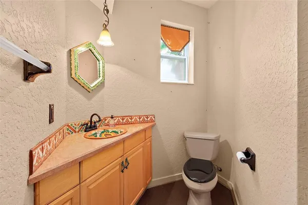 a view of hallway with stairs and wooden floor