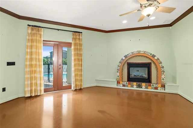a view of an empty room with closet and wooden door