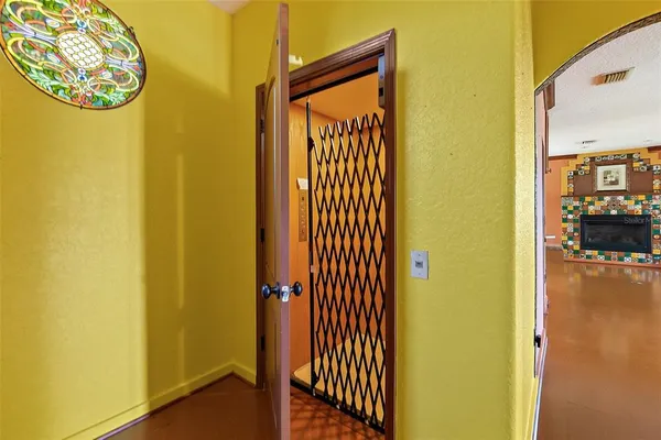 a front view of a house with plants