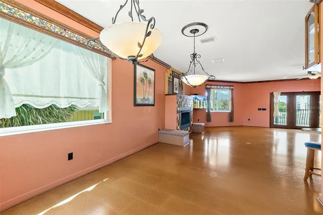 a view of a hallway with windows and stairs