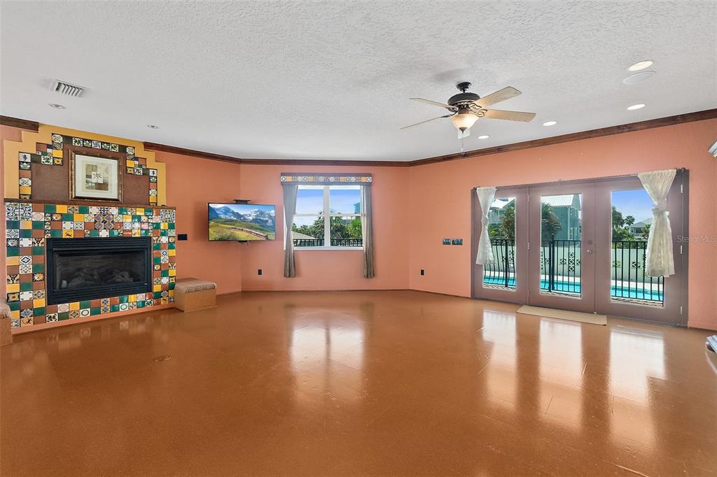 54 Ocean Street Palm Coast, FL 32137 - Photo 47 of 90 a view of a livingroom with furniture a ceiling fan and window