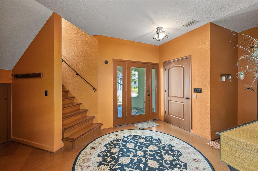 54 Ocean Street Palm Coast, FL 32137 - Photo 71 of 90 a view of a hallway with windows and stairs