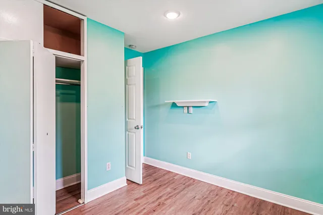 a view of a swimming pool with a patio and sitting area