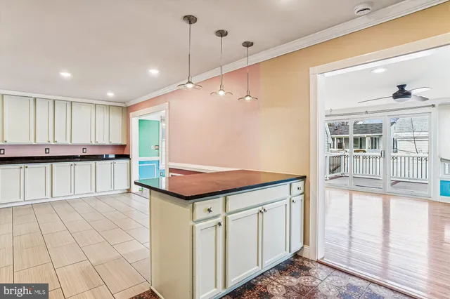a view of a house with a yard and a pond