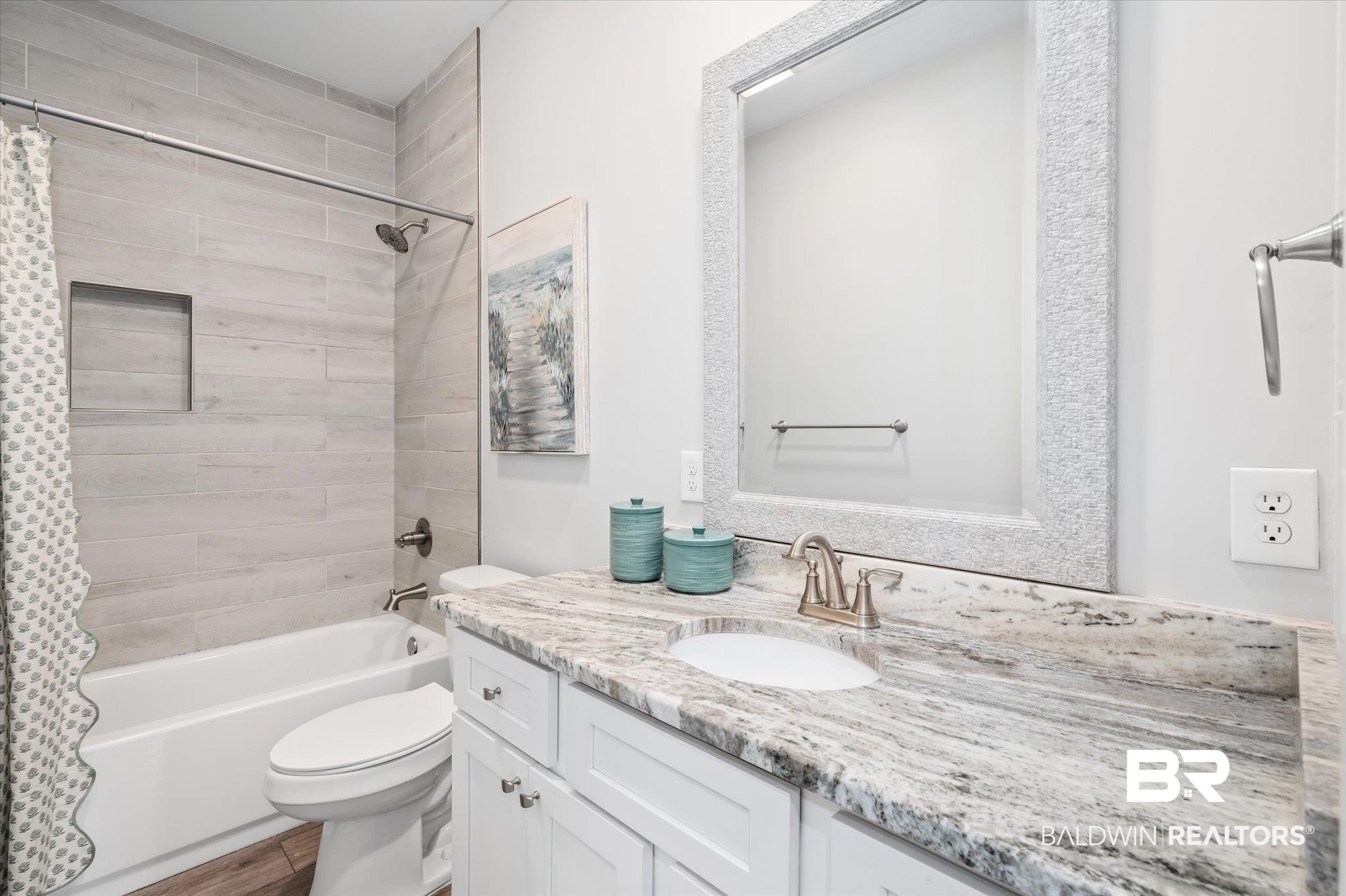 8056 Carmel Circle Foley, AL 36535 - Photo 17 of 28 Full bathroom featuring vanity, wood-type flooring, shower / bath combo, and toilet