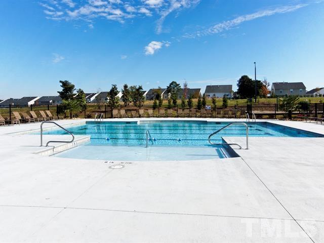 4124 Davis Meadow Street Raleigh, NC 27616 - Photo 15 of 15 a view of swimming pool with outdoor seating