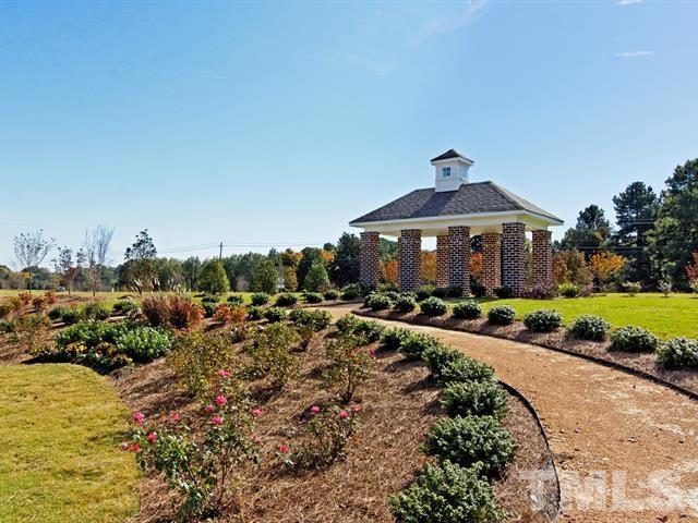 4124 Davis Meadow Street Raleigh, NC 27616 - Photo 7 of 15 a front view of a house with a yard