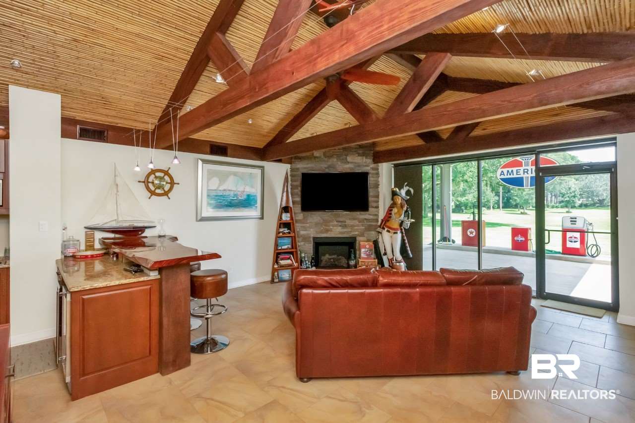 11000 Kelly Road Mobile, AL 36608 - Photo 20 of 48 Bamboo ceilings, fireplace, and wooden beams.