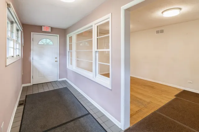 a kitchen with stove a sink dishwasher and a stove with wooden floor
