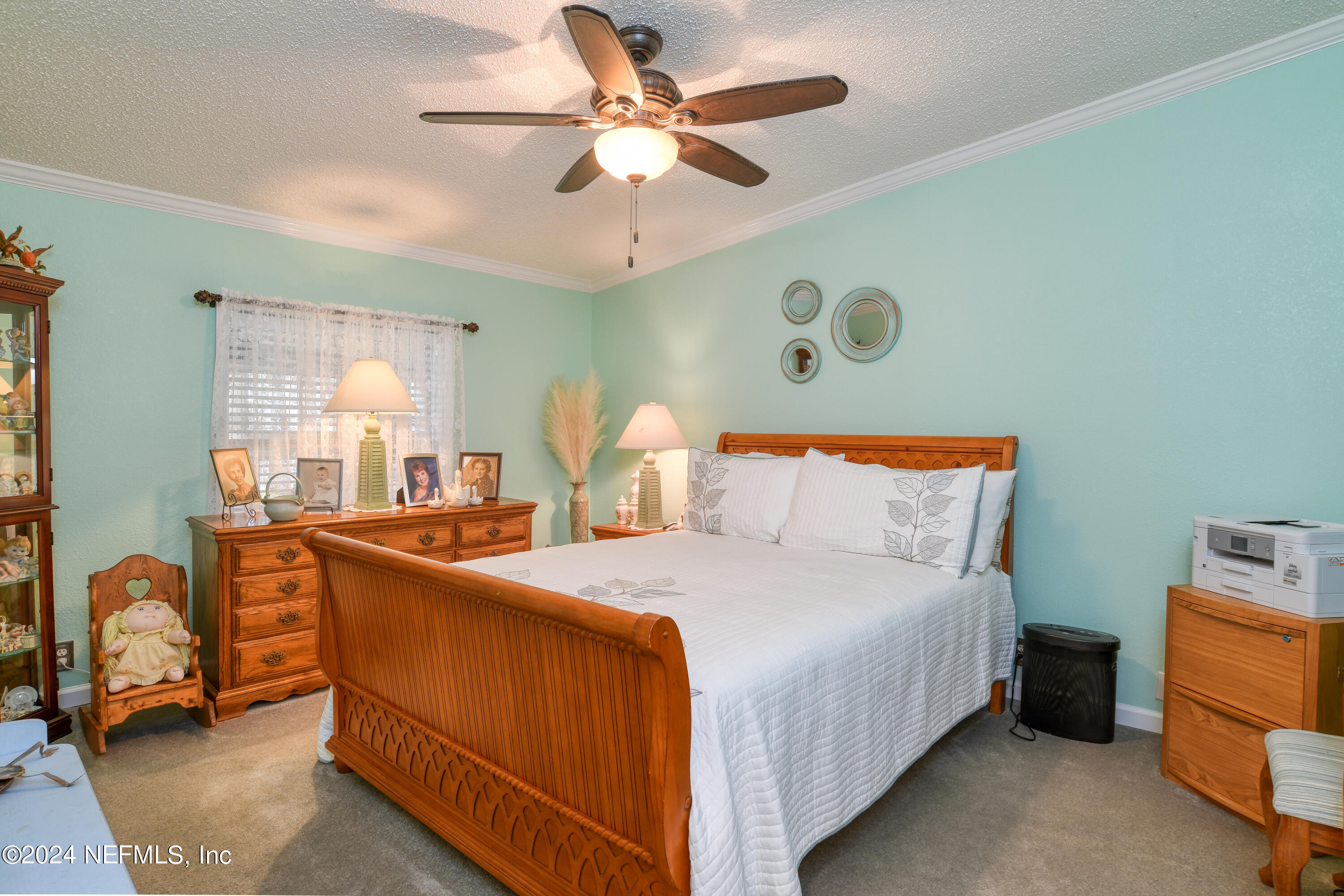 131 Sunset Drive Crescent City, FL 32112 - Photo 12 of 33 a bedroom with a bed and a chandelier