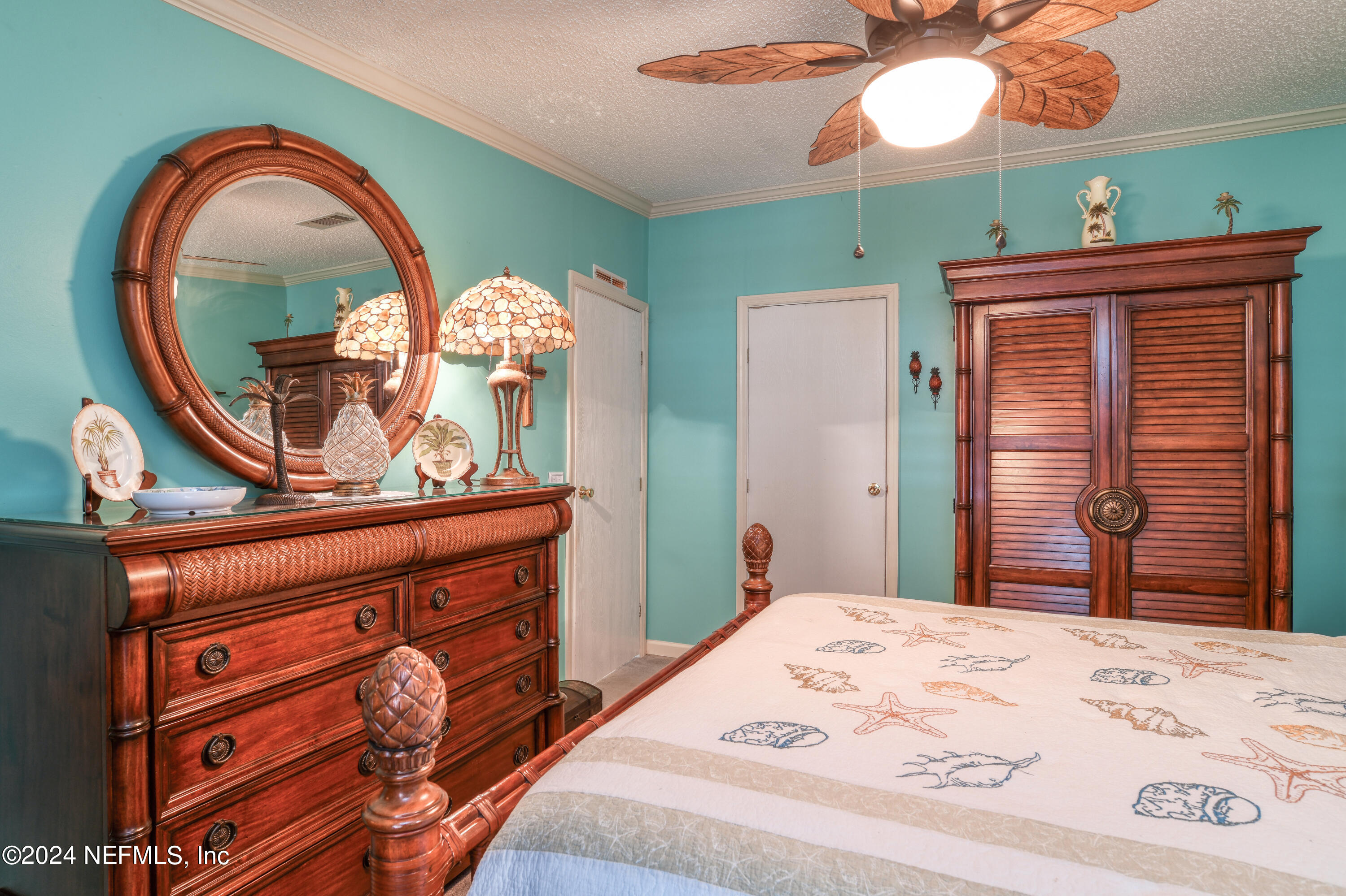 131 Sunset Drive Crescent City, FL 32112 - Photo 15 of 33 a bedroom with a bed and a dresser