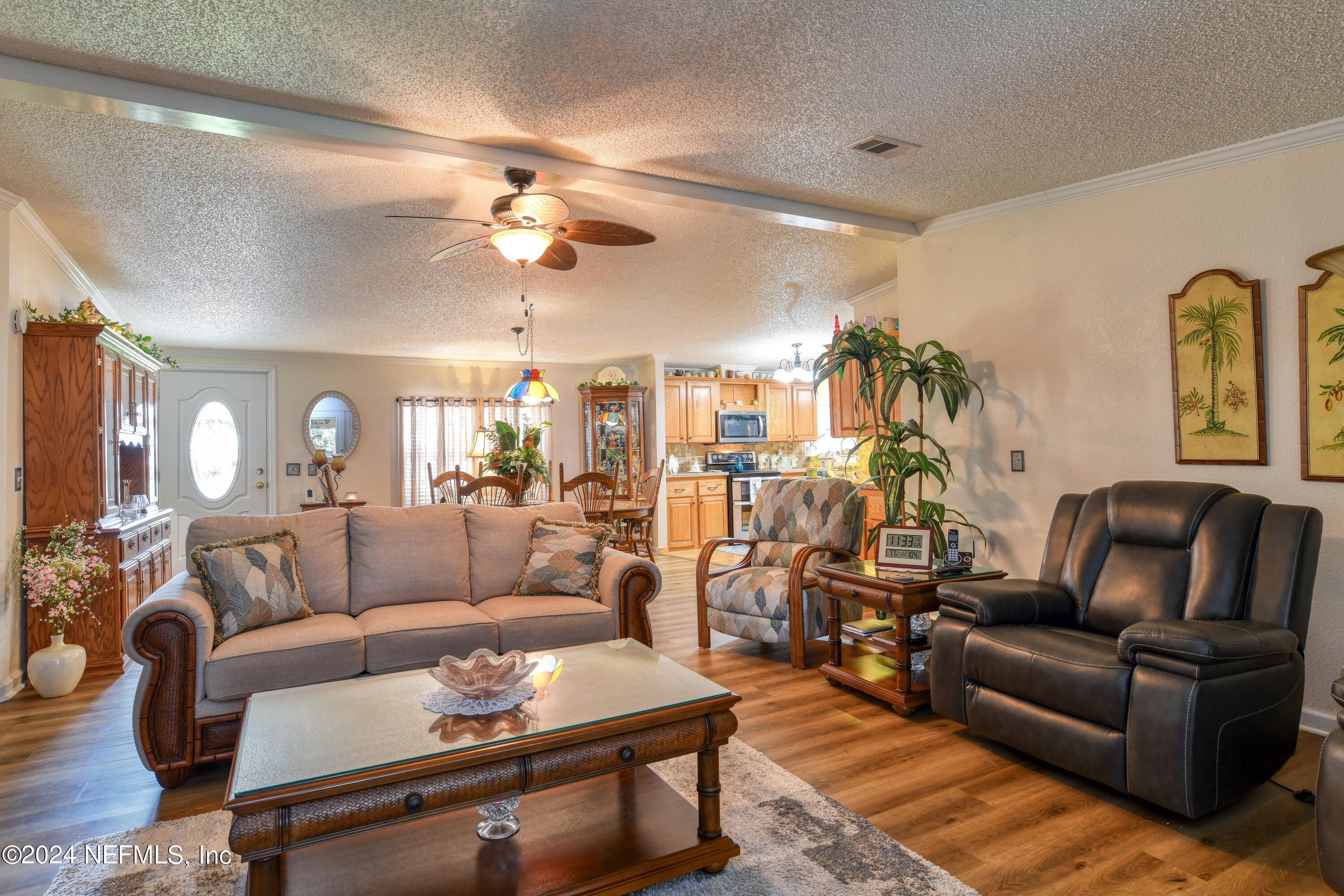 131 Sunset Drive Crescent City, FL 32112 - Photo 17 of 33 a living room with furniture and wooden floor