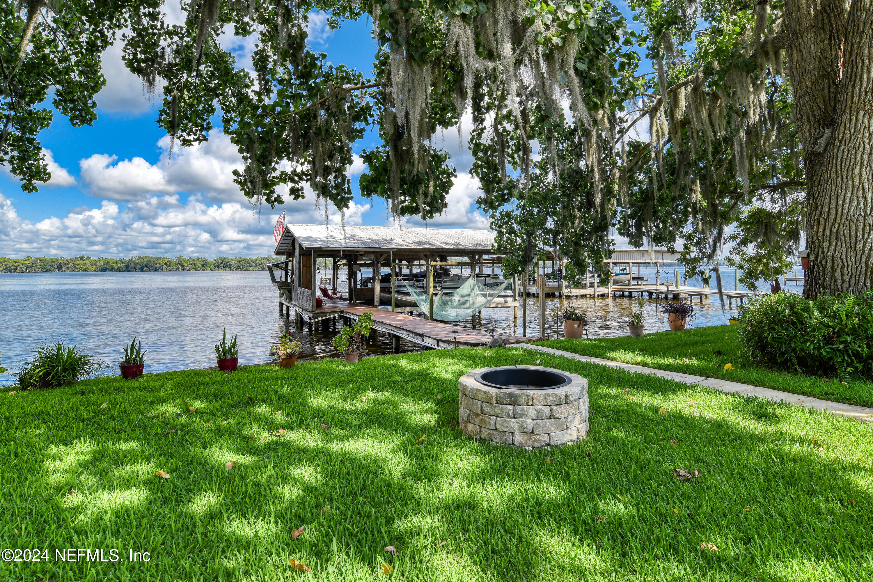 131 Sunset Drive Crescent City, FL 32112 - Photo 19 of 33 a view of a house with a yard balcony and a garden