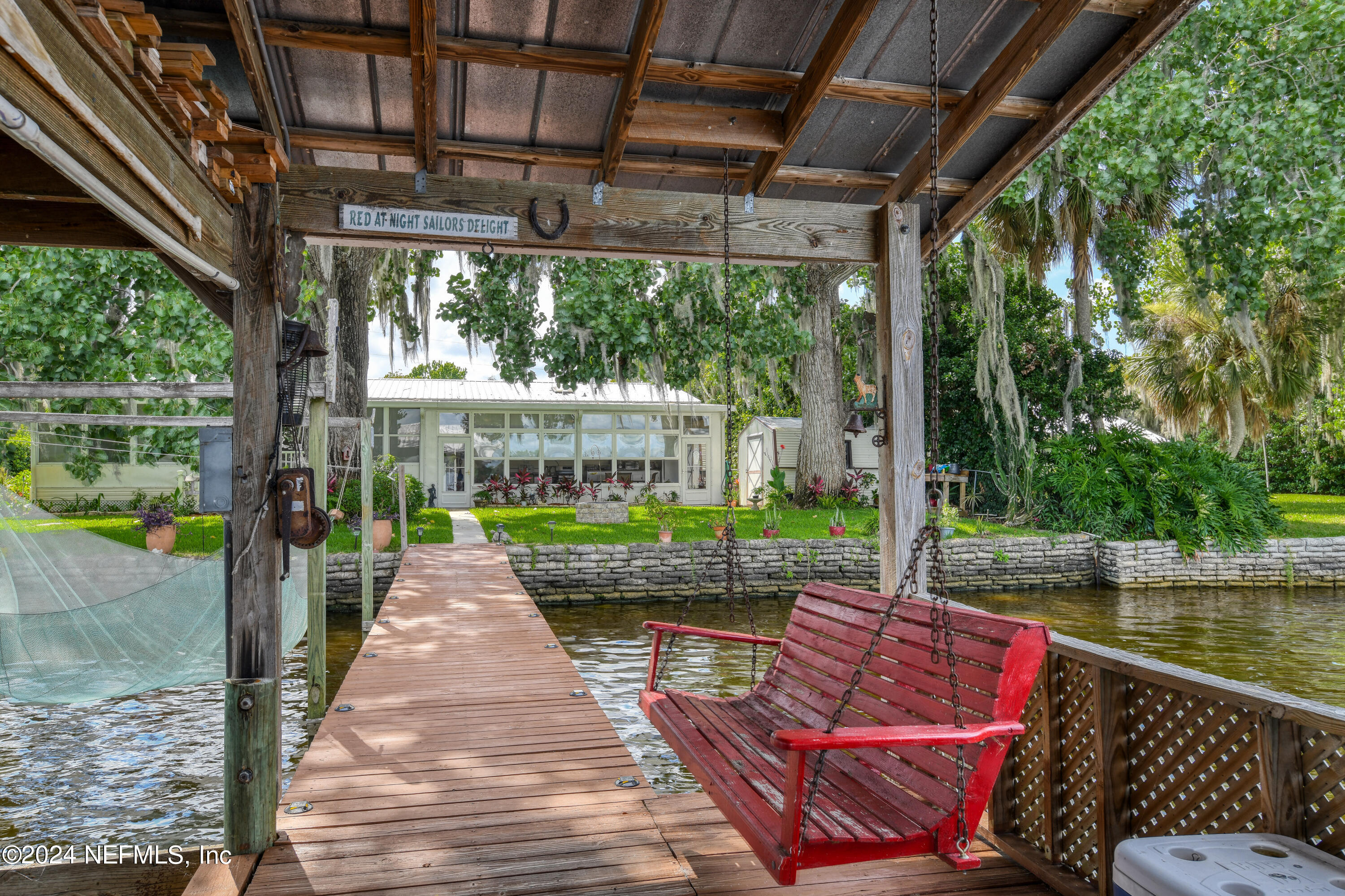 131 Sunset Drive Crescent City, FL 32112 - Photo 21 of 33 a view of a patio with a table chairs and a backyard