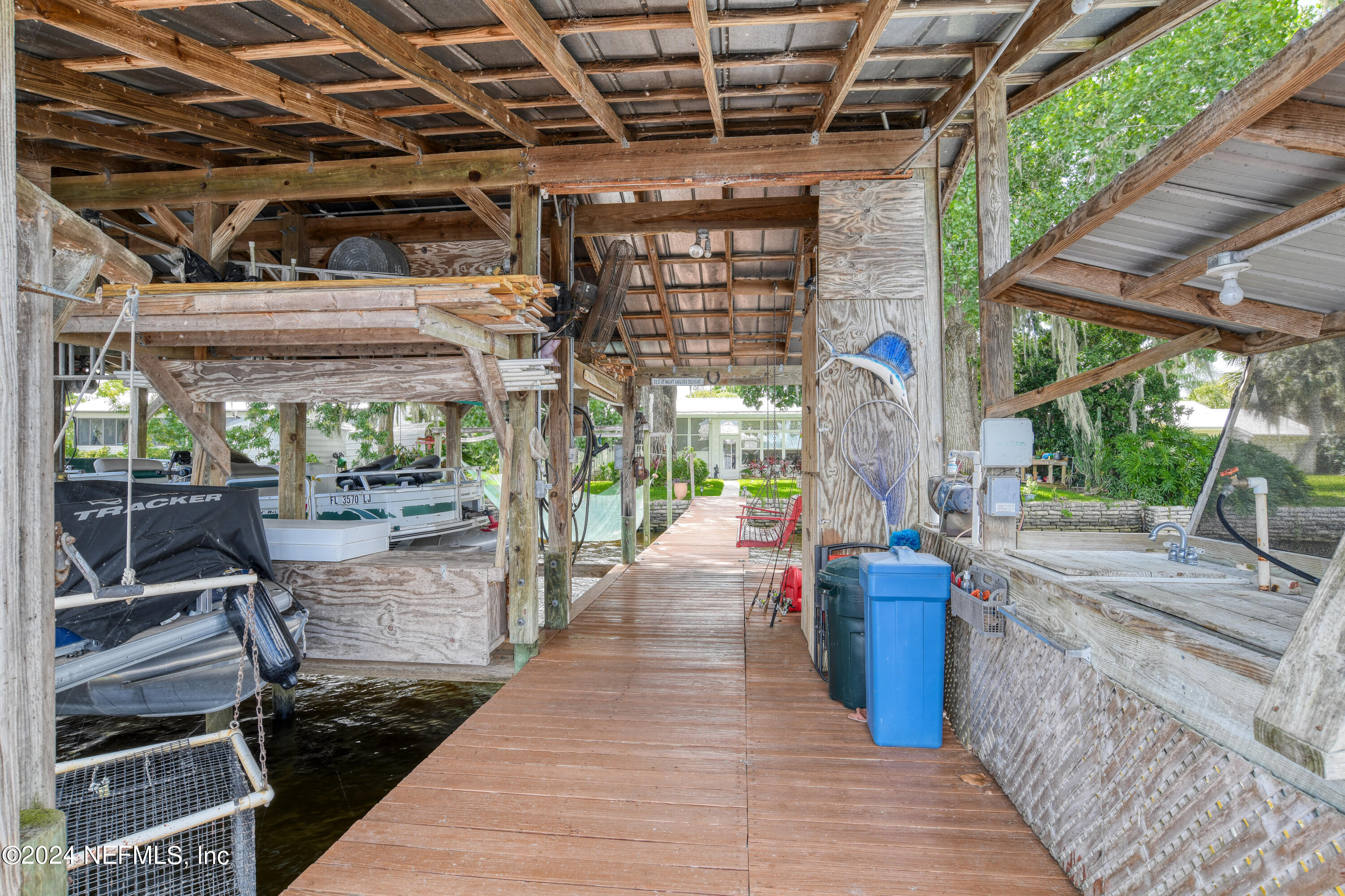 131 Sunset Drive Crescent City, FL 32112 - Photo 23 of 33 a view of a porch with wooden floor