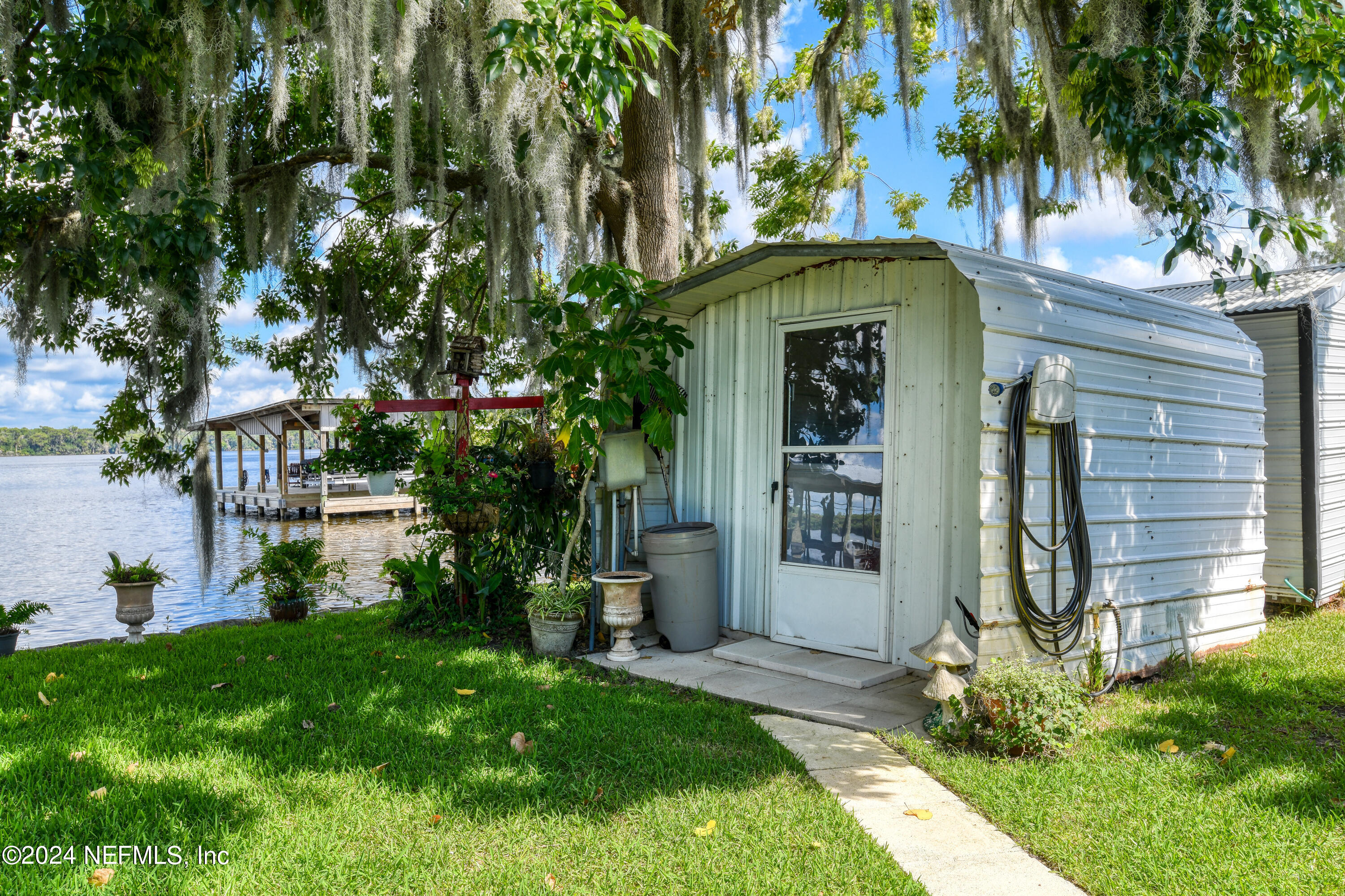 131 Sunset Drive Crescent City, FL 32112 - Photo 31 of 33 a front view of a house with garden