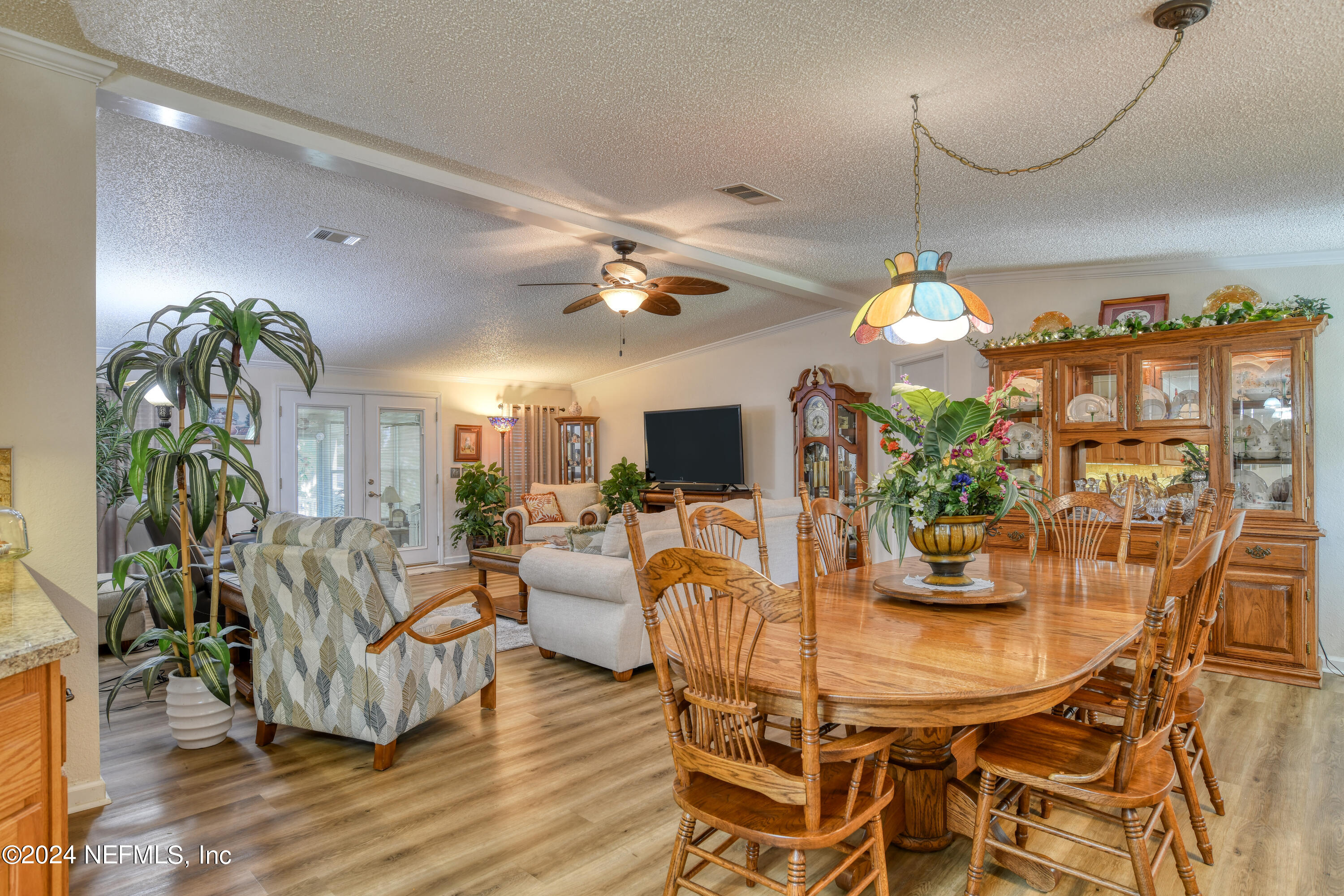 131 Sunset Drive Crescent City, FL 32112 - Photo 4 of 33 a view of a dining room with furniture and wooden floor