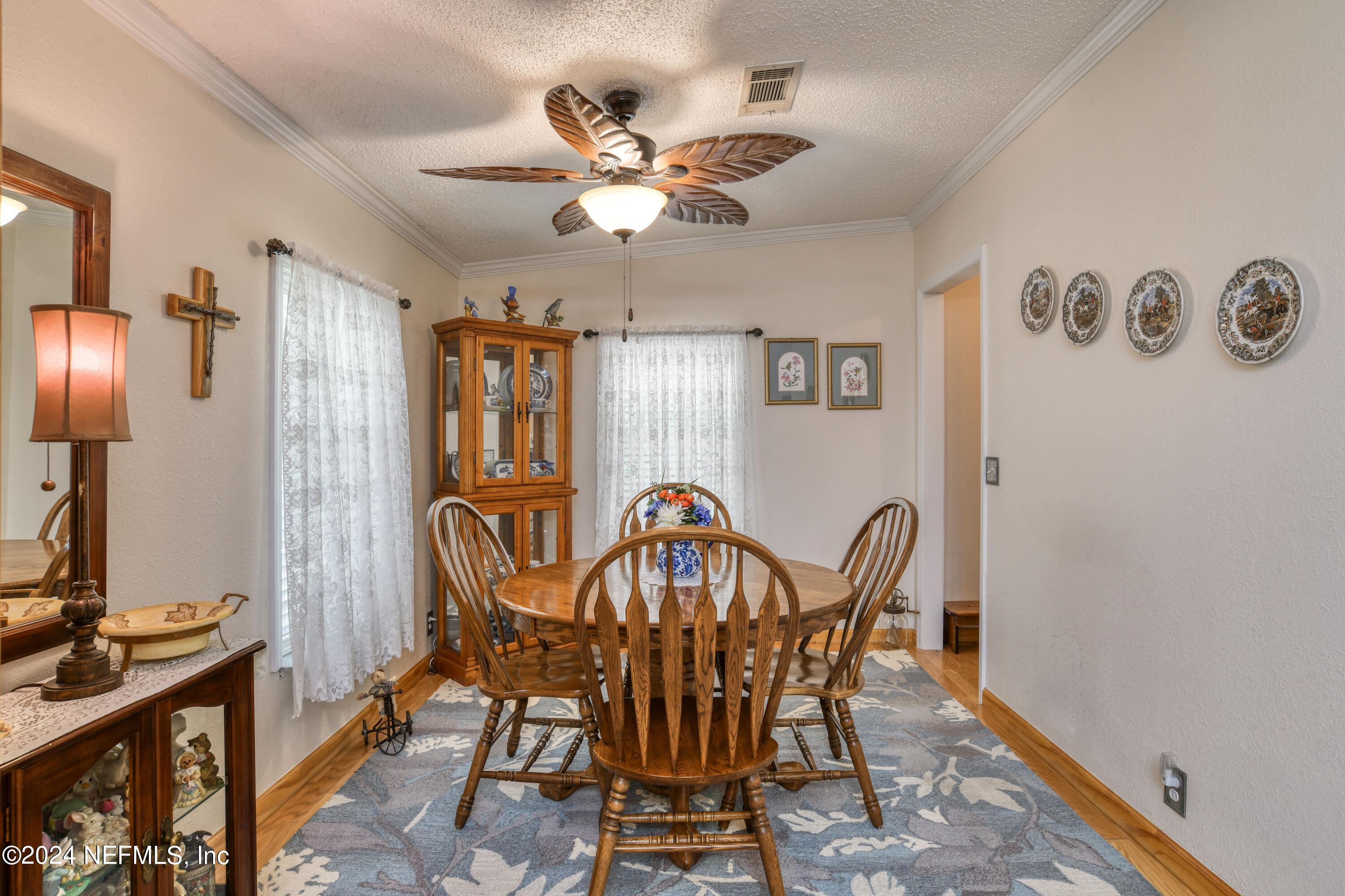 131 Sunset Drive Crescent City, FL 32112 - Photo 8 of 33 a view of a dining room with furniture and chandelier