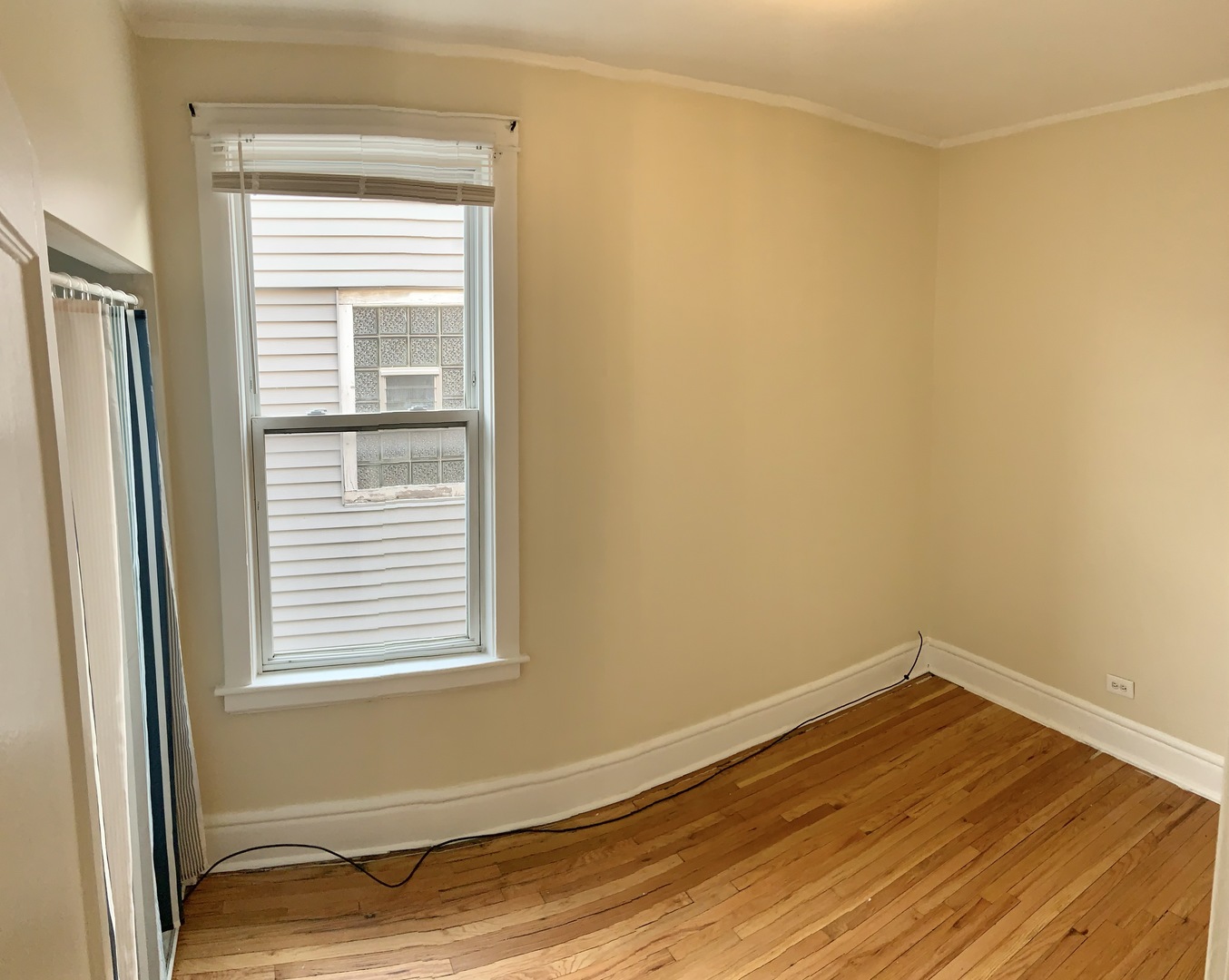 4847 West Hutchinson Street, Unit 2 Chicago, IL 60641 - Photo 8 of 8 a view of a room that has a window in it