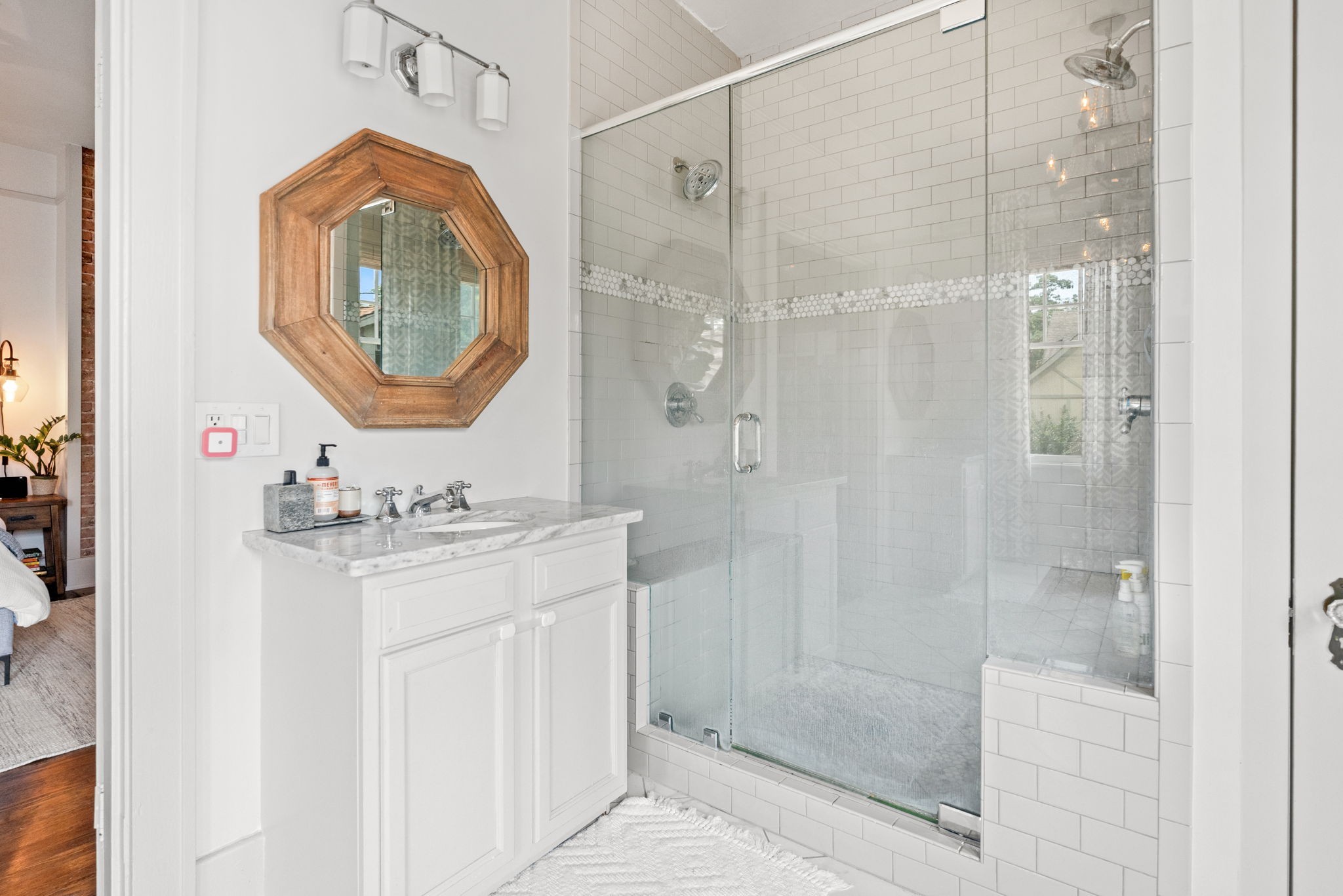 229 Lauderdale Road Nashville, TN 37205 - Photo 20 of 48 a bathroom with a sink a mirror a vanity and a shower