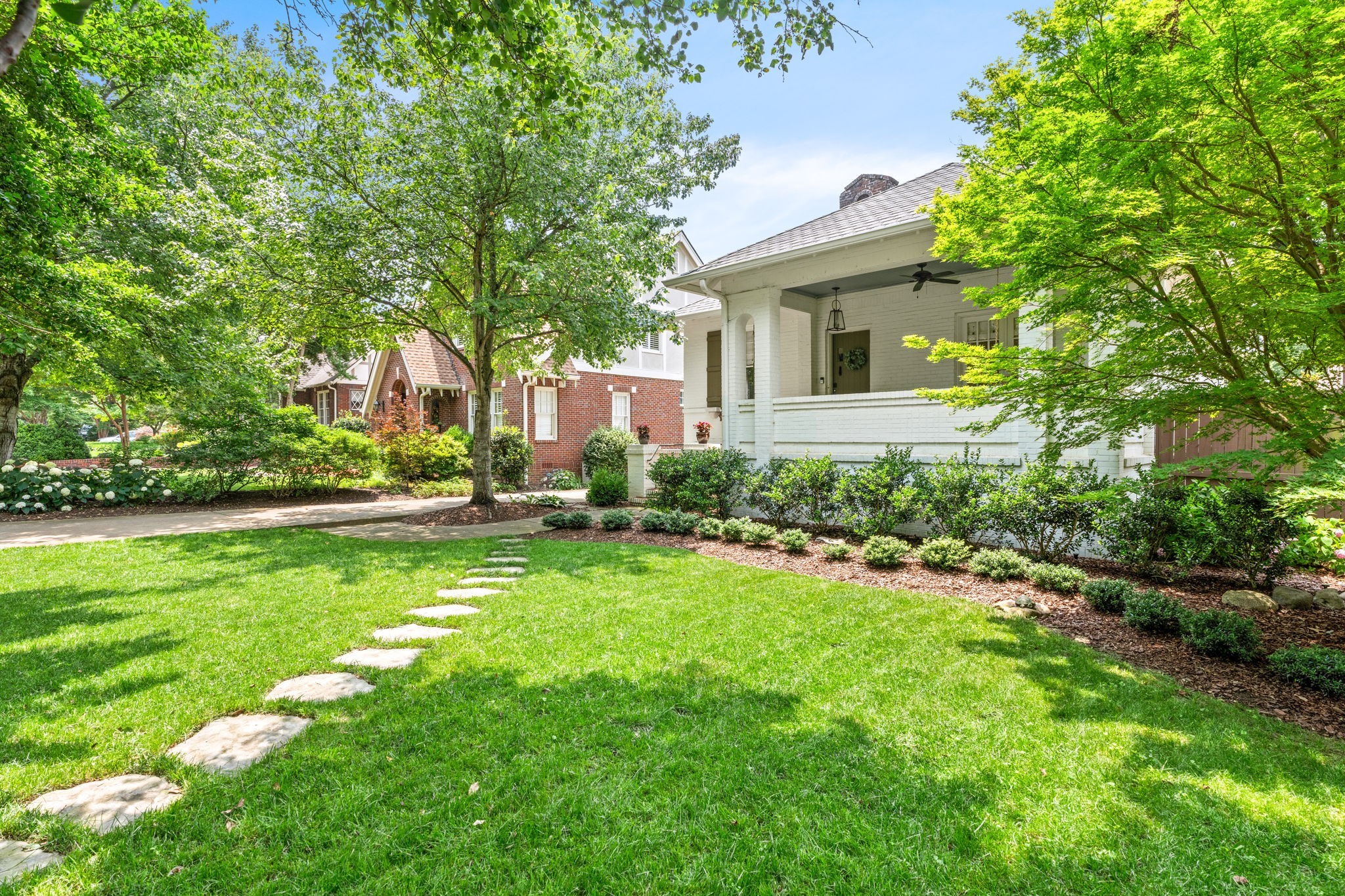 229 Lauderdale Road Nashville, TN 37205 - Photo 4 of 48 a front view of a house with garden
