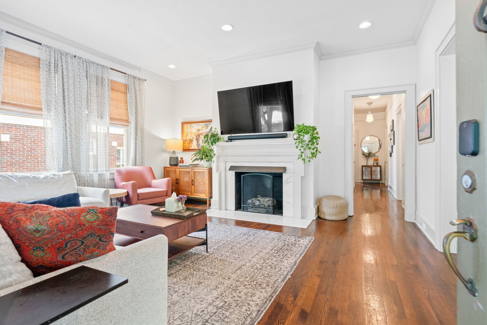 229 Lauderdale Road Nashville, TN 37205 - Photo 6 of 48 a living room with furniture a flat screen tv and a fireplace