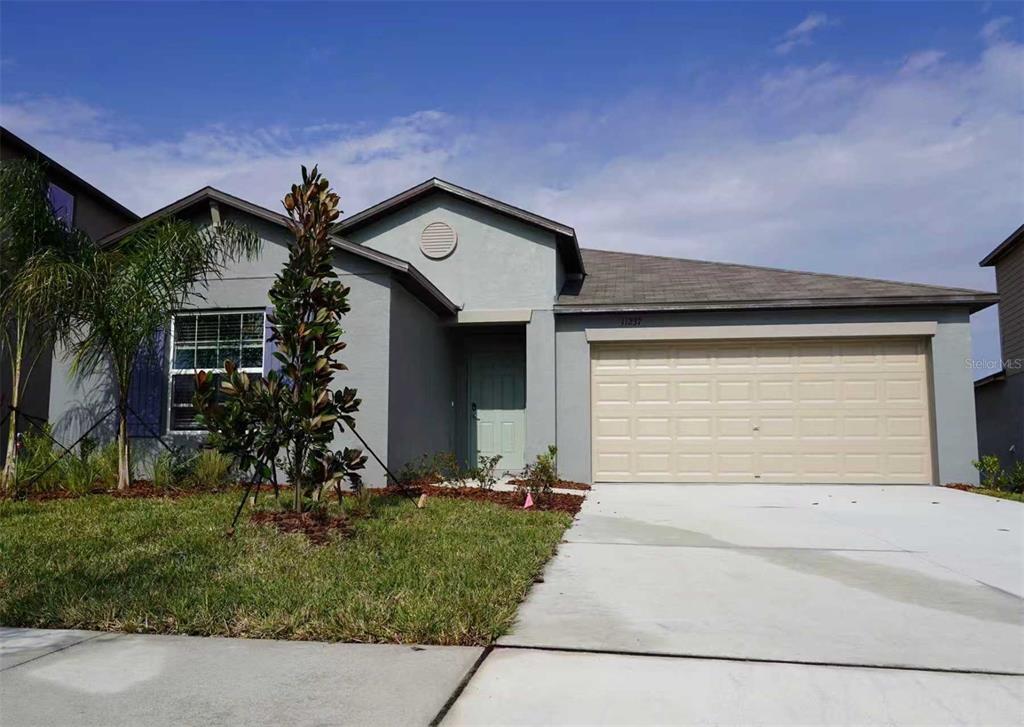 11237 Linden Depot Road San Antonio, FL 33576 - Photo 1 of 31 front view of house with a yard