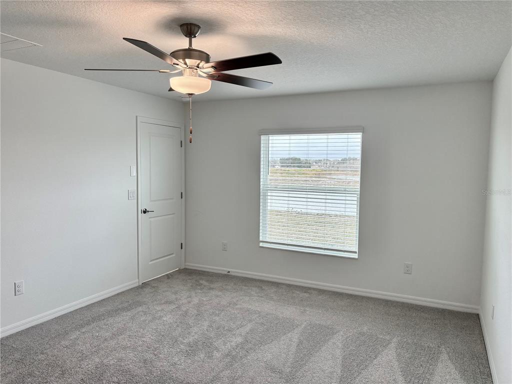 11237 Linden Depot Road San Antonio, FL 33576 - Photo 14 of 31 an empty room with a window