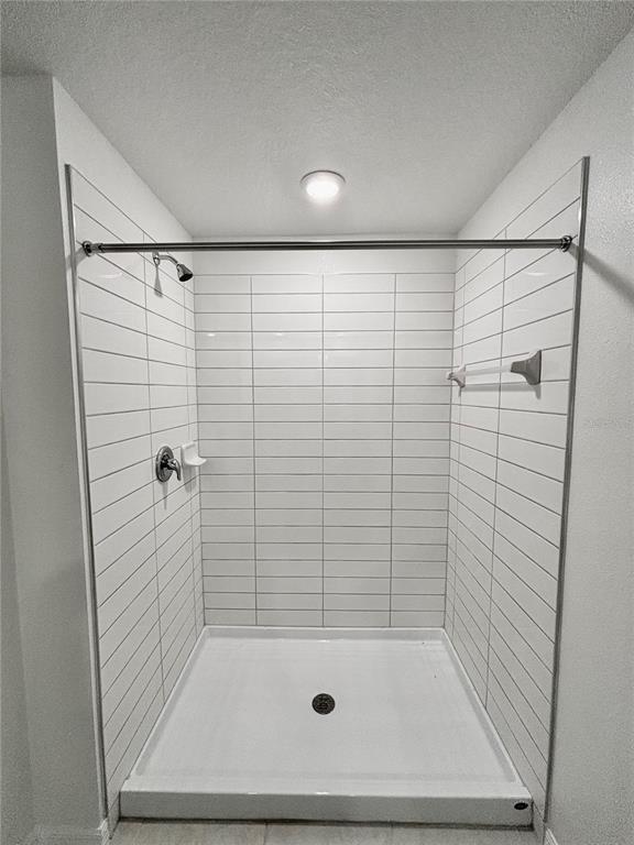 11237 Linden Depot Road San Antonio, FL 33576 - Photo 20 of 31 a bathroom with a shower and a bathtub