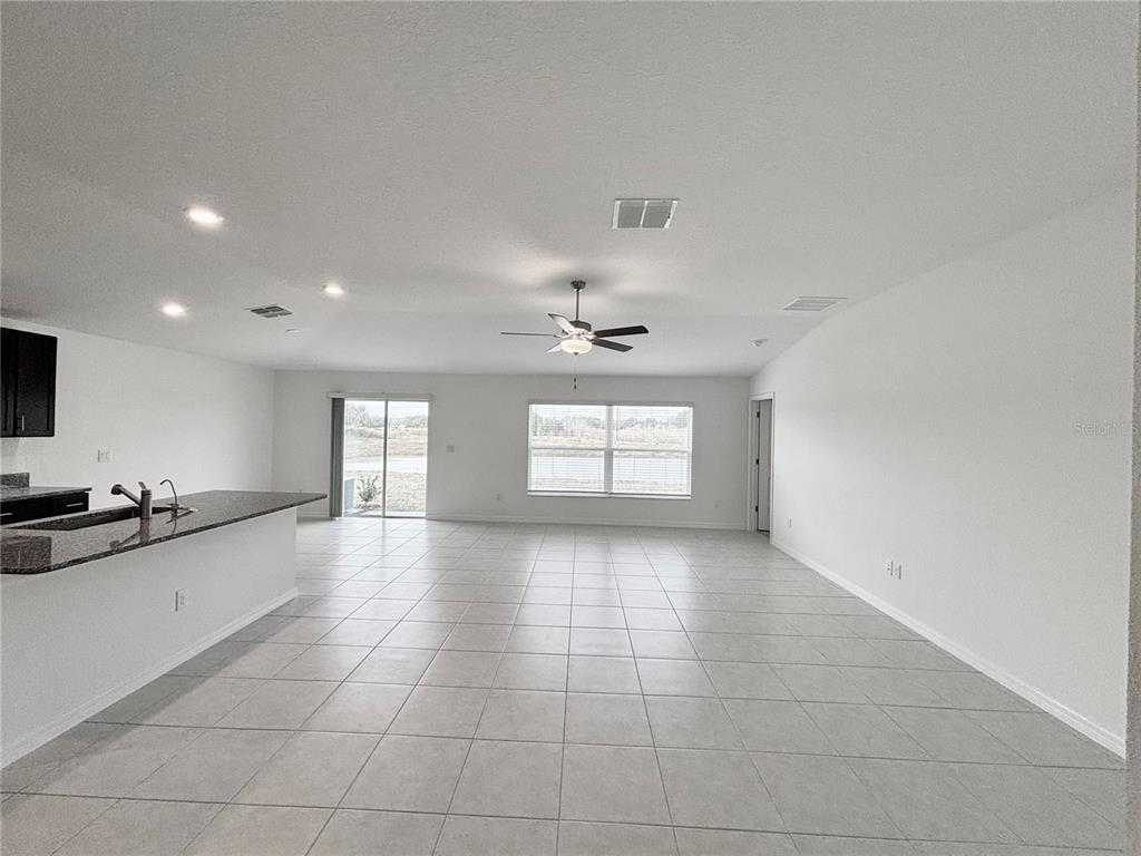 11237 Linden Depot Road San Antonio, FL 33576 - Photo 9 of 31 a view of a kitchen with a sink and a stove top oven
