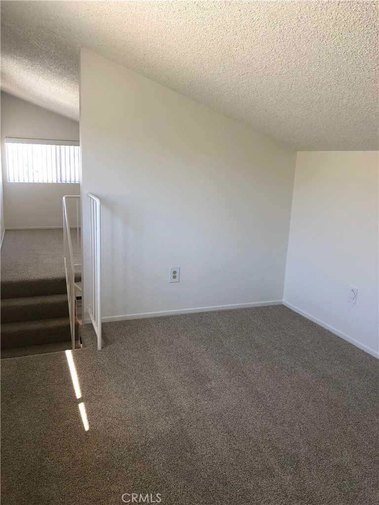16621 Dolores Lane, Unit B Huntington Beach, CA 92649 - Photo 13 of 22 a view of an empty room and window