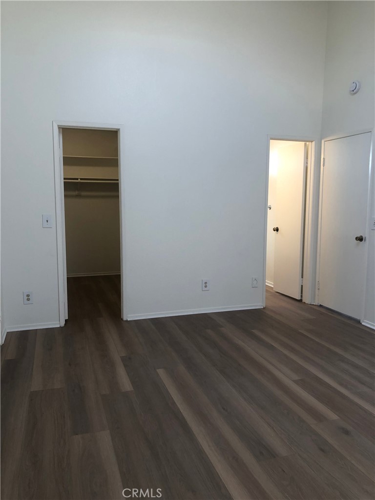 16621 Dolores Lane, Unit B Huntington Beach, CA 92649 - Photo 15 of 22 a view of a livingroom with wooden floor