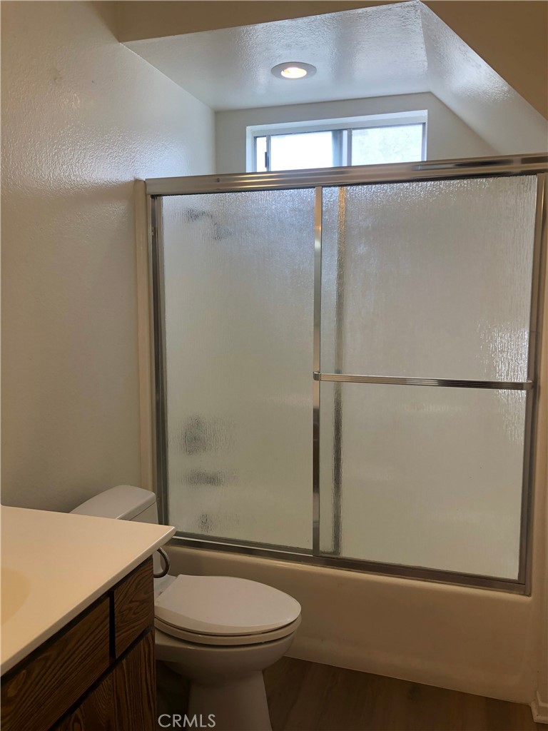 16621 Dolores Lane, Unit B Huntington Beach, CA 92649 - Photo 17 of 22 a bathroom with a granite countertop sink toilet and shower