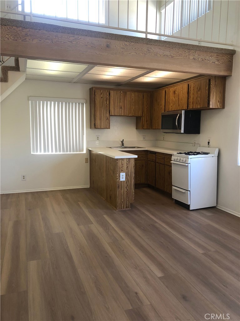 16621 Dolores Lane, Unit B Huntington Beach, CA 92649 - Photo 9 of 22 a kitchen with a sink and cabinets