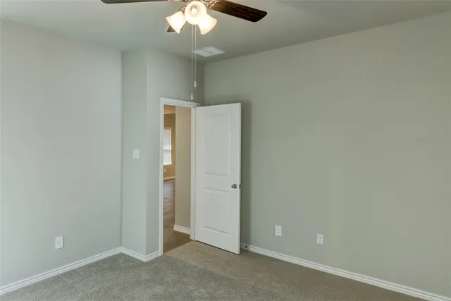 an empty room with a bathroom