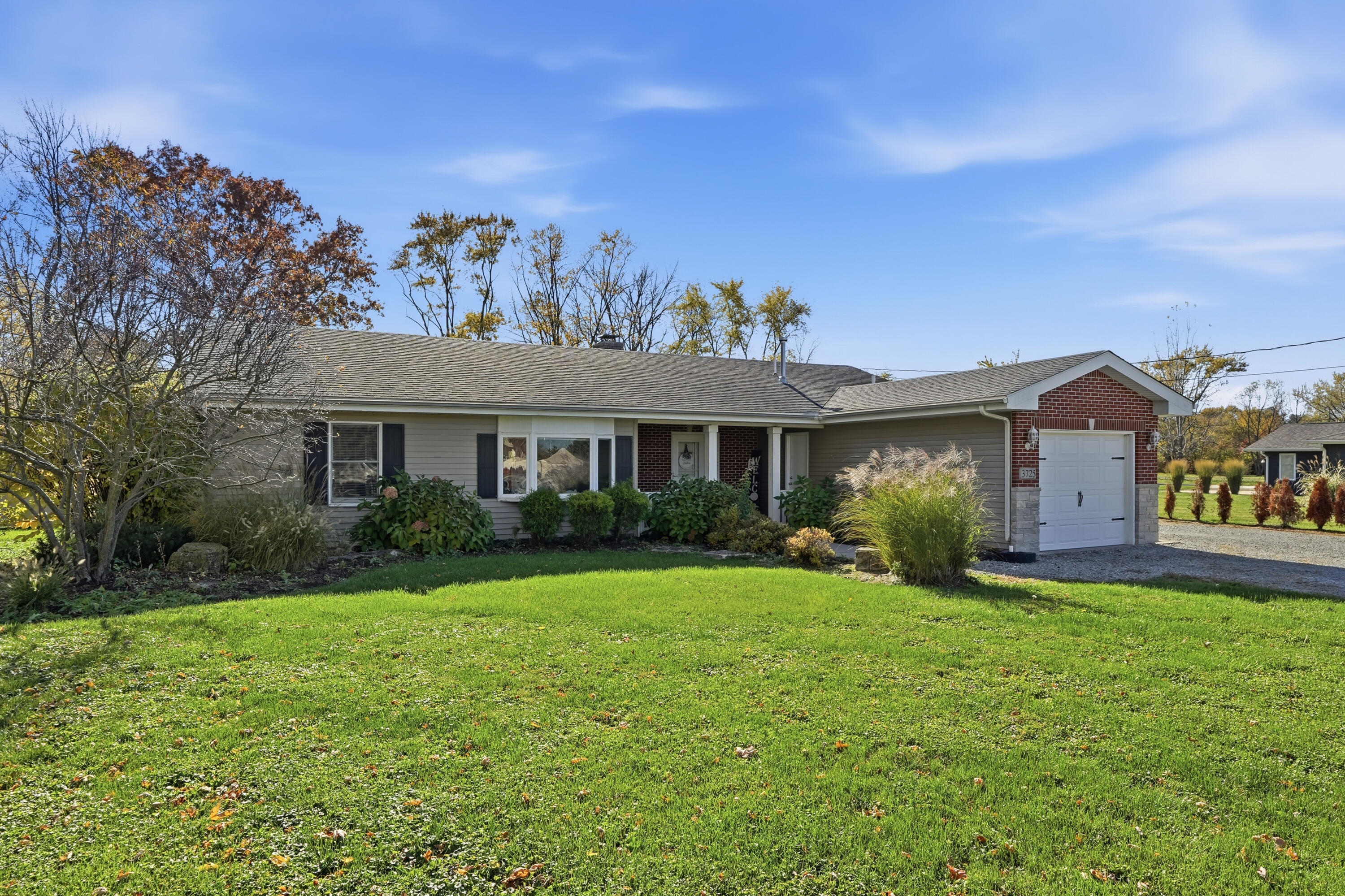 3725 West 105th Avenue Crown Point, IN 46307 - Photo 1 of 37 a front view of a house with a yard and garage