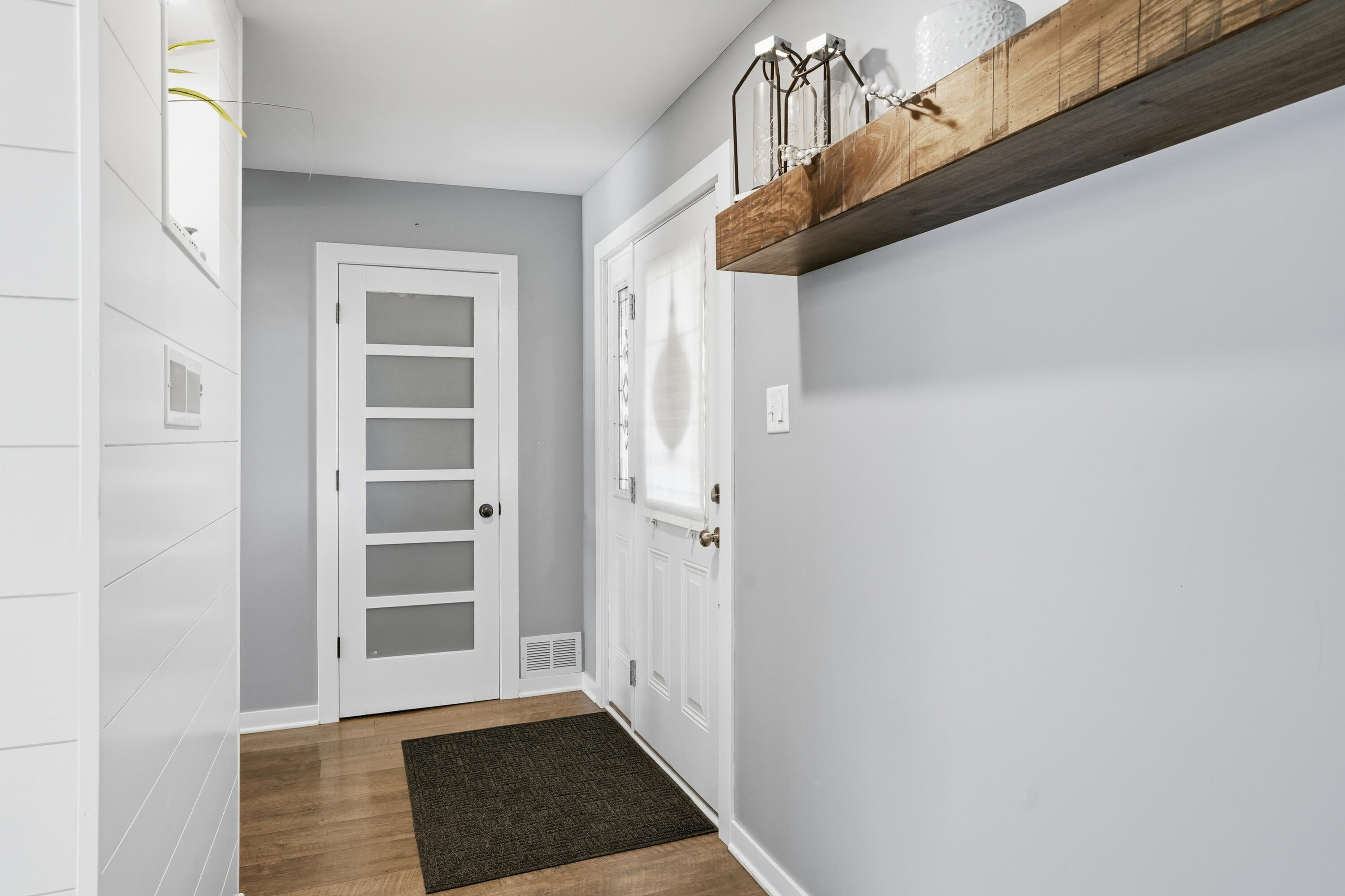 3725 West 105th Avenue Crown Point, IN 46307 - Photo 30 of 37 a view of a hallway with wooden floor and windows