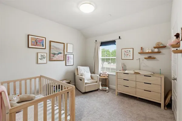 a bedroom with furniture and a window