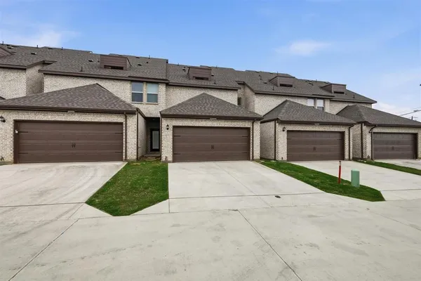 front view of a house and a yard