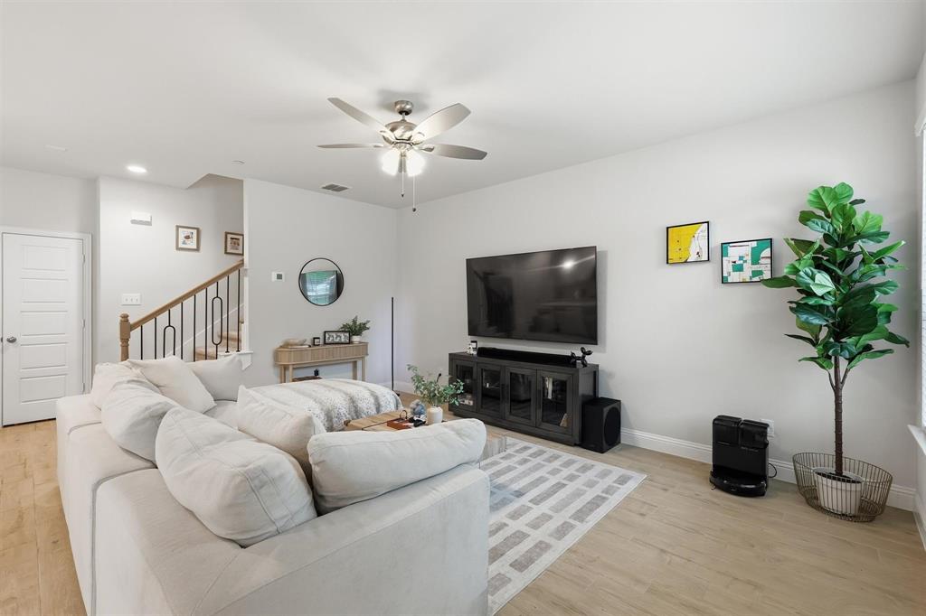 6132 Bursey Road Watauga, TX 76148 - Photo 7 of 26 a living room with furniture and a flat screen tv